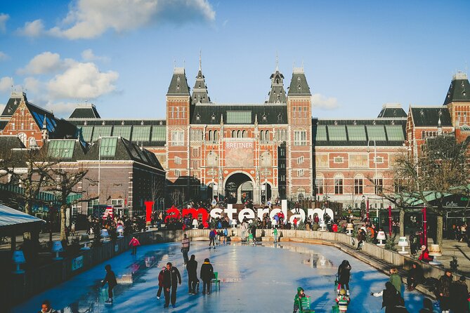 Amsterdam Day Trip from Brussels With Cheese, Clogs and Windmills - Dam Square and the Royal Palace