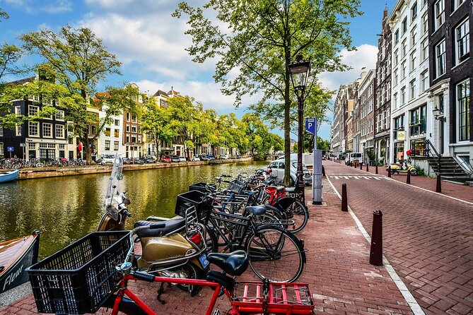 Amsterdam Day Trip from Brussels With Cheese, Clogs and Windmills - Guides, languages, and group size