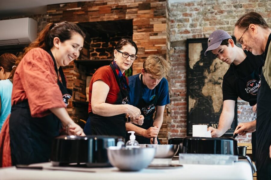 Bruges: Belgian Praline and Mendiants Chocolate Workshop - Decorating mendiants with dried fruit