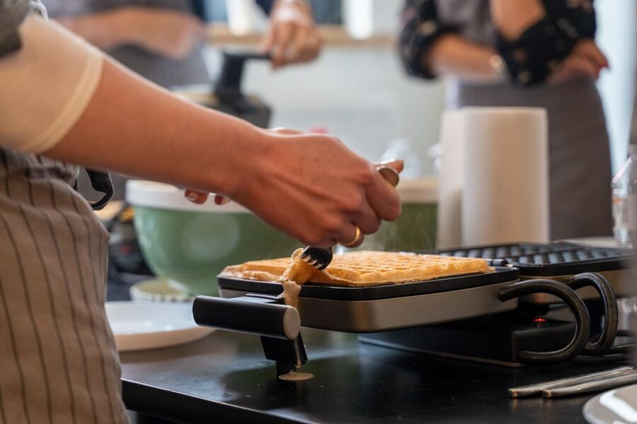 Bruges: Belgian Waffle-Making Workshop with Beer Tasting - Choosing toppings and eating your work