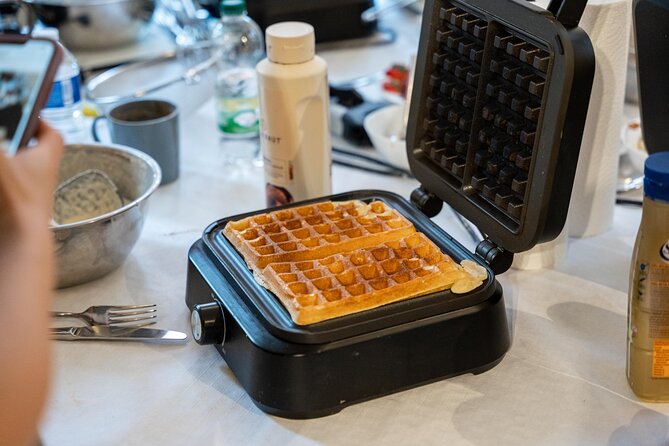 The Waffles 'n Coffee Breakfast in Bruges Centre - Choosing chocolate, cream, syrup, and Biscoff